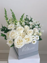 Load image into Gallery viewer, A collection of white florals such as roses, snapdragons, alstroemeria, and lisianthus designed in a grey square box.