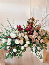 Load image into Gallery viewer, A floral arrangement with a variety of flowers including roses and other foliage, designed in shades of white, pink, and red, intended for use as funeral flowers.