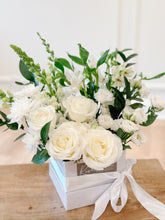 Load image into Gallery viewer, a collection of white florals such as roses, alstroemeria, lisianthus, and chrysanthemums designed in a white square hat box.
