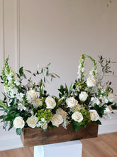 Load image into Gallery viewer, A wooden box arrangement of various flowers including roses, hydrangea, and snapdragons, with a color combination of green and white.
