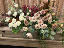 Load image into Gallery viewer, deluxe casket spray with white roses, amnesia and quicksand roses, as well as cimbidium orchids and foliage 
