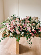 Load image into Gallery viewer, large funeral casket spray with pink, white, and peachy florals with foliage
